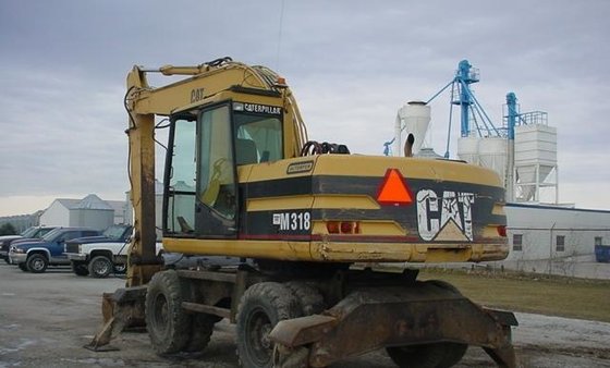 1999 Caterpillar M318 in Espergærde,