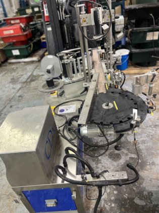 CDA Wraparound Bottle Labeler Model E-Fill in Toronto, Ontario, Canada