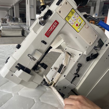 ゾリーテック 自動マットレステープ端部加工機 マットレス生産ライン用