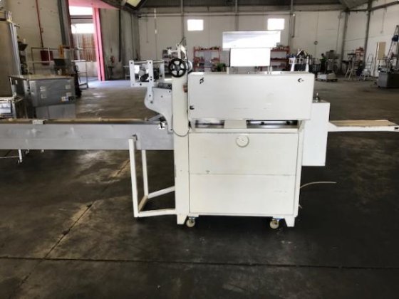 Pallet flow-pack machine