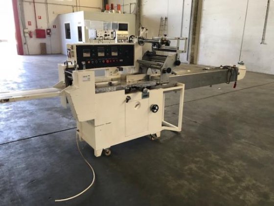 Pallet flow-pack machine