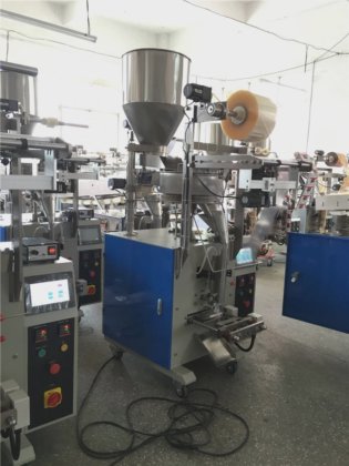 Dession 米および他の中国の自動微粒のコップの充填機