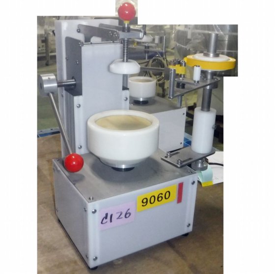 【蓋のテープ止め機】