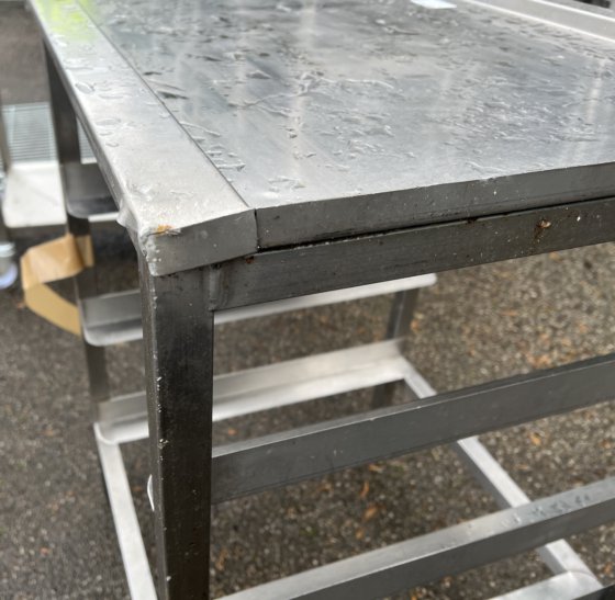 Stainless steel pass through dishwasher table with tray racking