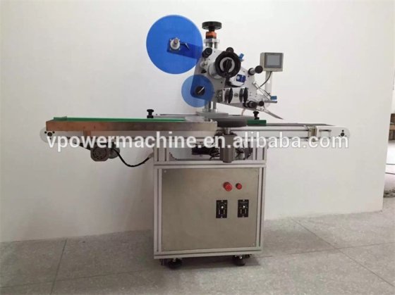 用于扁瓶或方瓶、肥皂的自动容器顶部不干胶贴标机