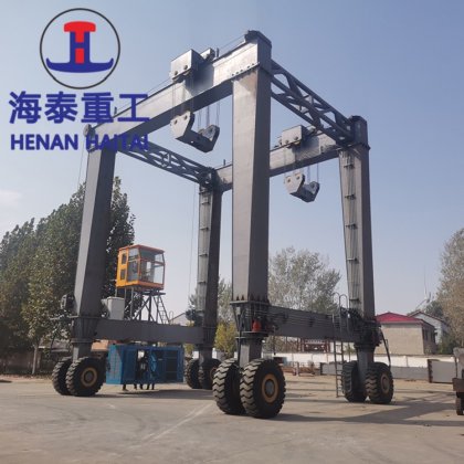中国 Ht クレーン ゴム製タイヤを付けられた車輪販売のための油圧ガントリー クレーンのまたがりのキャリア
