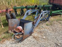 Tip bucket loader off SC