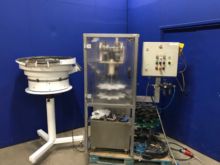 Capsule screw machine for bottles,