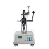 Spring compression testing machine