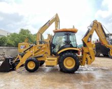 Backhoe Loader Busy at Both