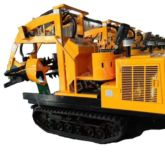Backhoe laoder with tree spade