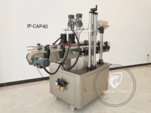 Automatic inline capping machine